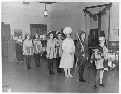 Girls from Ontario Ladies' College prepare for the annual boar's head procession