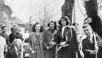 Mildred Thompson, Doreen Loudfoot, and Maebelle Rowley attend Whitby's Victory in Europe Day Parade, 1945.