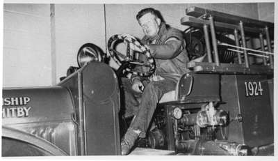 Donald Mitchell Sr. on 1924 Reo Fire Truck