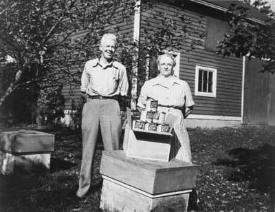 Albert and Ethel Walker Pose with Award-Winning Honey