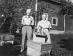 Albert and Ethel Walker Pose with Award-Winning Honey