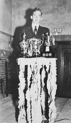 Gerald Bracey with High School Athletics Trophies, 1947