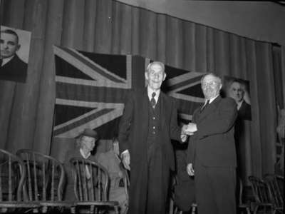 The Hon. Mr. Gardiner, M.L.A. and Minister of Agriculture shaking hands with the oldest voter in Ontario Riding