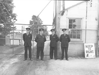 Four men standing on guard
