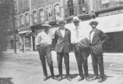 Group of men standing on Brock Street