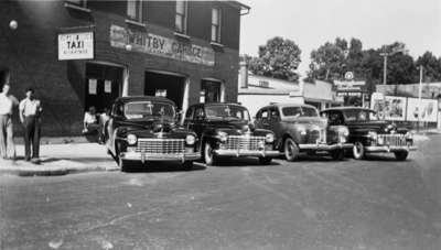 Taxis in front of Heard’s Garage