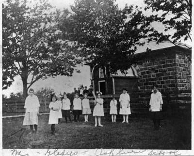 Girls Baseball Team in front of Ashburn Public School