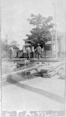 Three men in front of Bishop Philander Smith House, c.1907