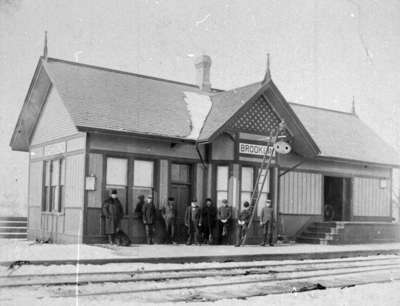 Several men standing in front of Brooklin Railway Station