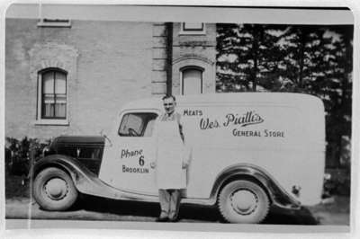 Joseph Wesley Piatti Standing in Front of Grocery Truck