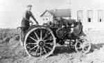 Louis Northam Operating a Tractor in front of Cottages at Ontario Hospital Whitby, c.1915