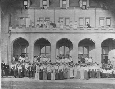 People gathered in front of Frances Hall at the Ontario Ladies' College, May 25, 1903