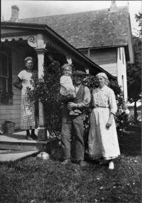 Carmichael family standing in front of house, c.1915