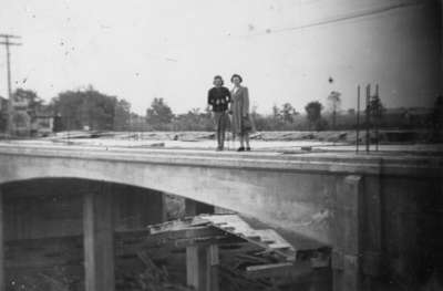 Mary Helen Steffler and Bernadette Marie Steffler standing on Brock Street Bridge over 401, September 28, 1941