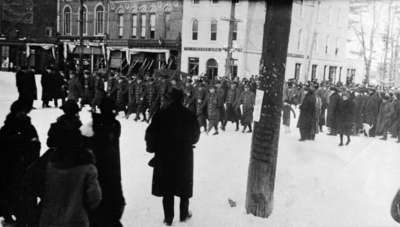 Soldiers of the 116th (Ontario County) Battalion marching along Dundas Street at Brock Street, 1916