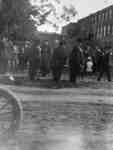 Officials standing on Dundas Street after a Parade, 1915