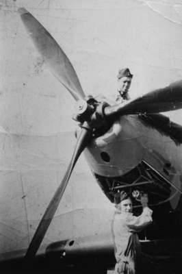 Portrait Photo of Two Unidentified Soldiers with a plane