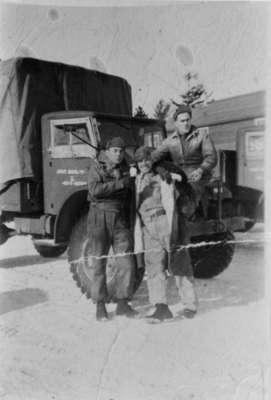 Photo of three soldiers at an Ontario Regiment truck (Oakley St. Pierre is the soldier at the far right side of the photo - sitting on the truck)