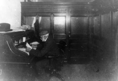 John Dundas Howden at his desk in the Post Office, c.1910-1924