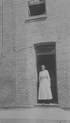 Laura Pellow standing in the doorway of Samuel Trees and Company (Blanket Factory), c.1915