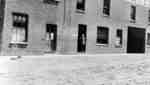 Samuel Trees standing in the doorway of Samuel Trees and Company (Blanket Factory), c.1915