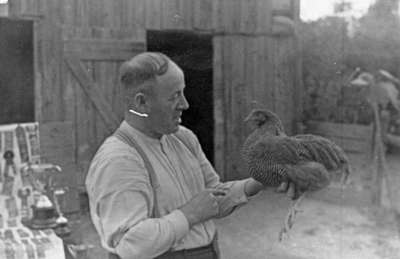 John Thomas with hen, c.1940