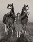 Unidentified woman with two horses