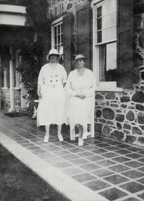 Two unidentified women in front of the Arnold House