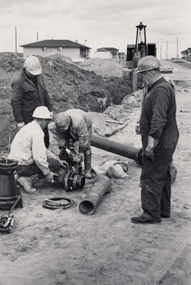 Lucien &quot;Frenchie&quot; Gagne (right) at work