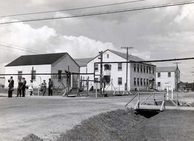 D.I.L. People waiting for a bus on Harwood Ave. and King's Cres.