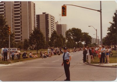 A Police Officer Directing Traffic for a Parade