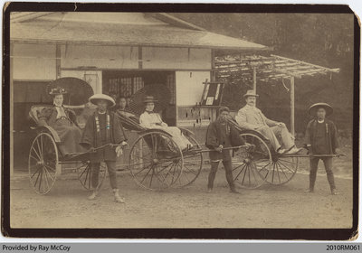 Photo of man and women with rickshaw drivers in Kyoto, Japan