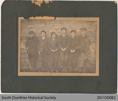 Group of Boys in Front of a Wall