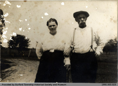 Woman with Man Holding a Cane