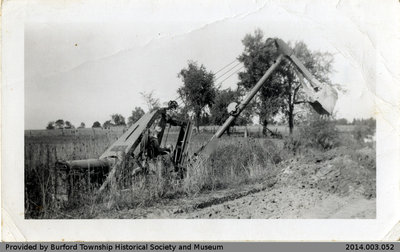 Backhoe Digging a Ditch