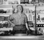 Photograph of Mr. Cronin Working at the Grocery Store in Glen Morris