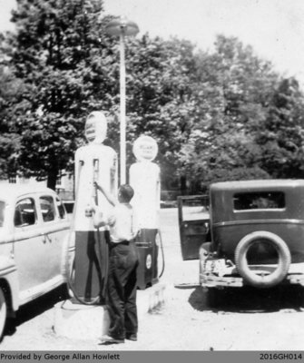 Photograph of Mr. Wilson Working at the Gas Pumps in Glen Morris