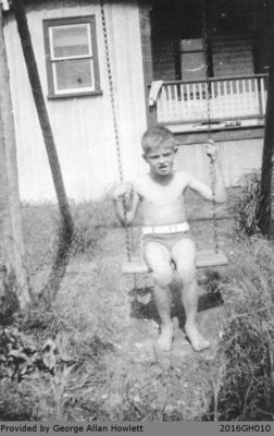 Photograph of George Allan Howlett outside of the Howlett House in Glen Morris