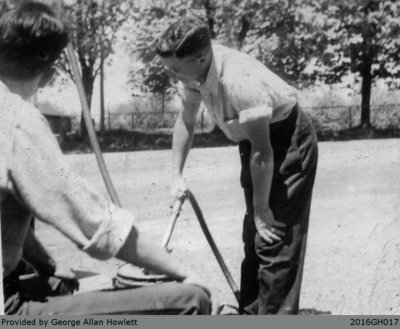 Photograph of Mr. Wilson Putting Gas Into Cars in Glen Morris