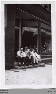 Men in front of VanDusen Block