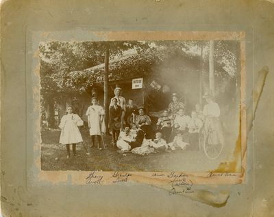 Arrell and Sawle family members in front of cottage