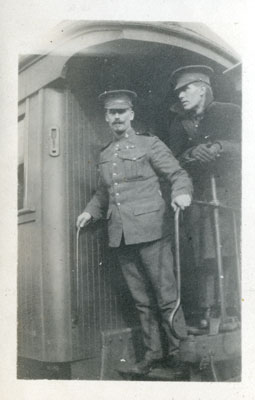 Two soldiers standing on a train