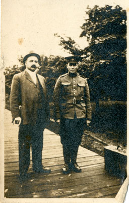 Photograph of 2 men on a boardwalk