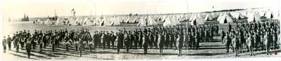 Panorama photograph of soldiers, some holding musical instruments