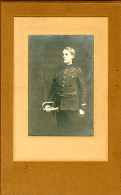 Soldier Fred G. Wright in uniform holding a bugle