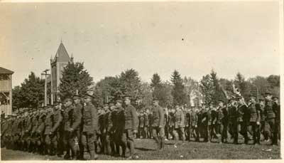 4 rows of soldiers standing on a lawn