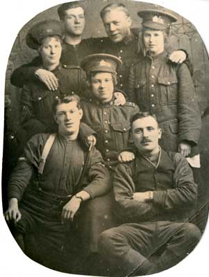 Photograph of 7 soldiers, 3 of which are female