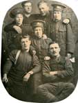 Photograph of 7 soldiers, 3 of which are female