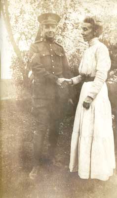 Photograph of soldier shaking a woman's hand