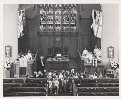 Rev. MacMillan leading children's lesson during service between 1962-1965.